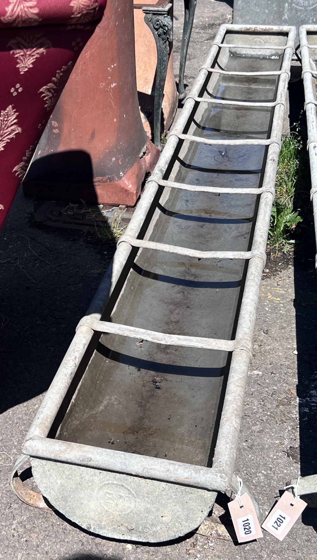 A galvanised feeding trough, length 247cm, depth 28cm, height 20cm